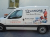 Digitally printed images and self-adhesive lettering applied to van