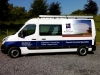 Partial vehicle wrap and self-adhesive lettering applied to van