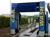 Car wash unit wrapped with self-adhesive graphics